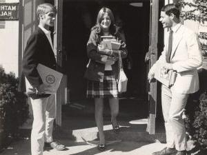 Female Trinity College student with books leaving Mather Hall at registration time, 1969.